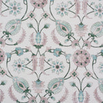 Detail of fabric in a floral paisley print in shades of pink and green on a cream field.