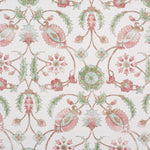 Detail of fabric in a floral paisley print in shades of rust and green on a cream field.