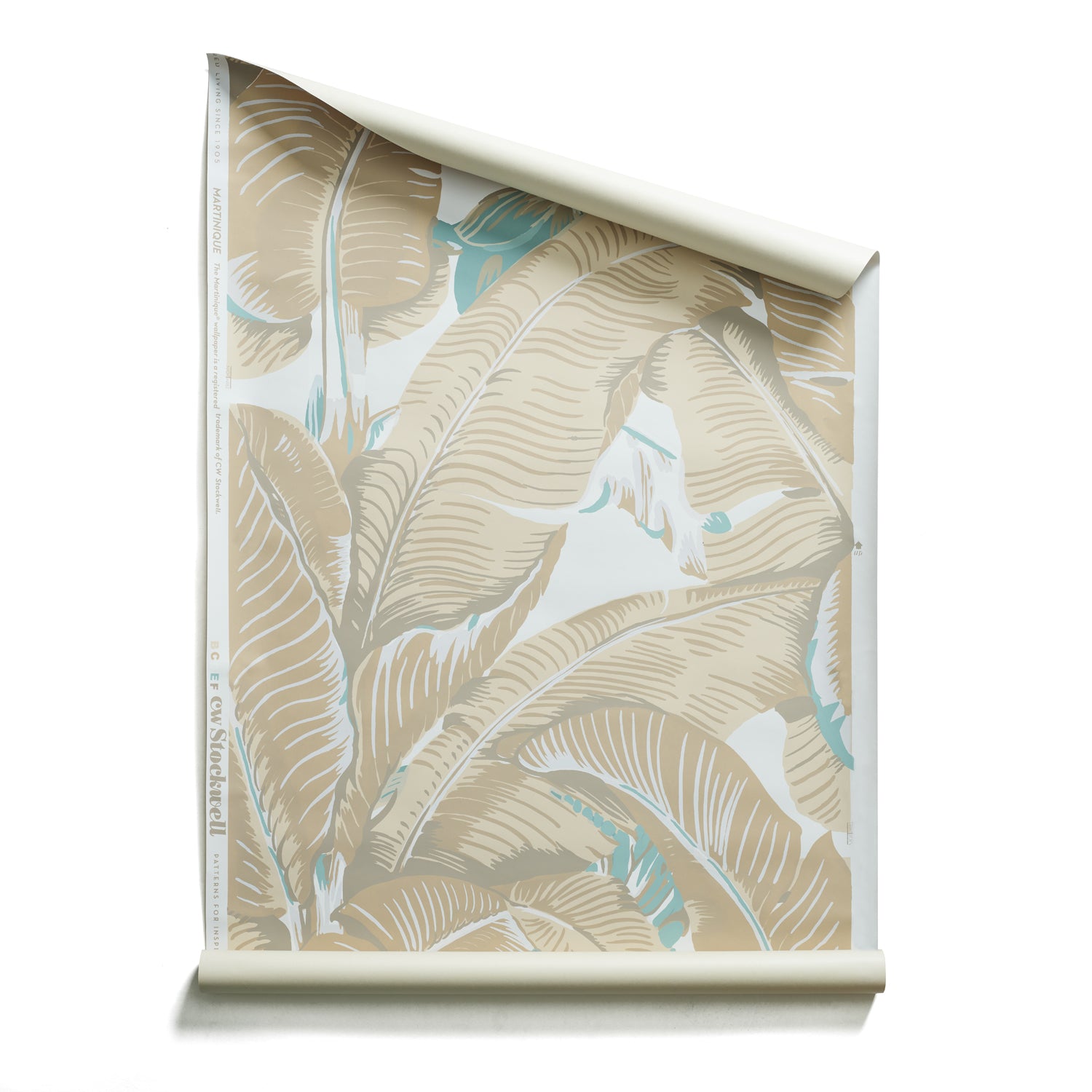 Roll of Banana leaf pattern wallpaper in beige, white, and light blue.