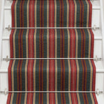 Striped flatweave runner in red and black on white staircase