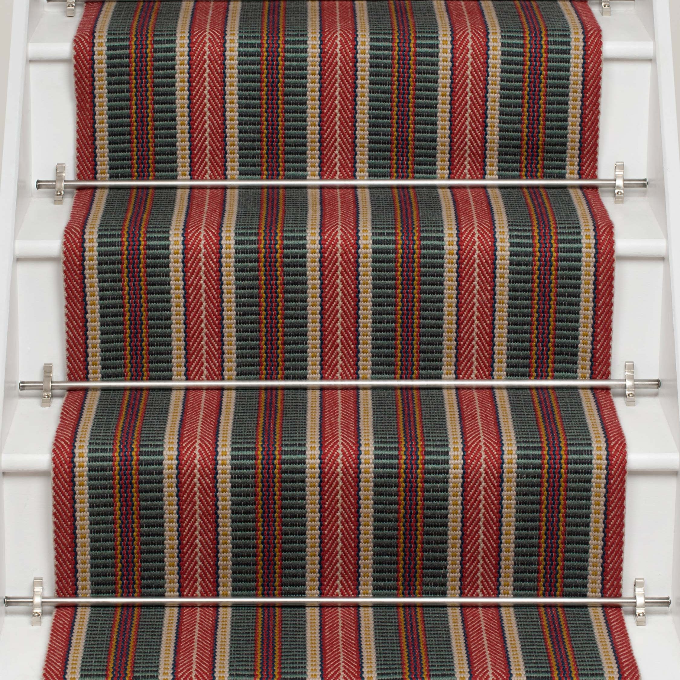 Striped flatweave runner in red and black on white staircase