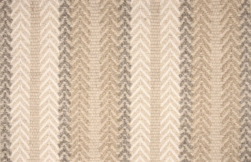 Broadloom carpet swatch in a herringbone pattern in a cream neutral tan design