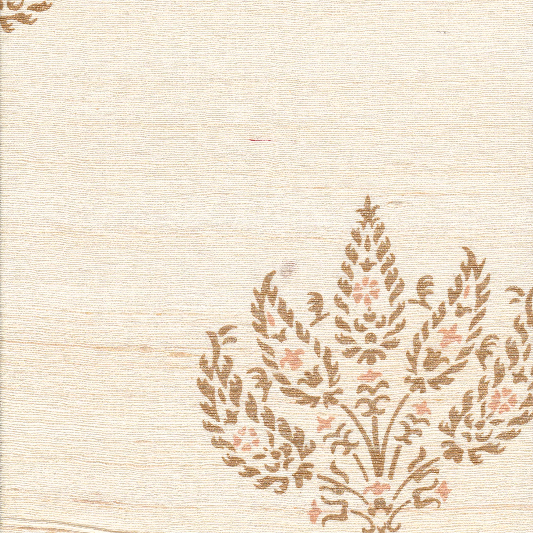Detail of fabric in a paisley floral print in brown and pink on a cream field.