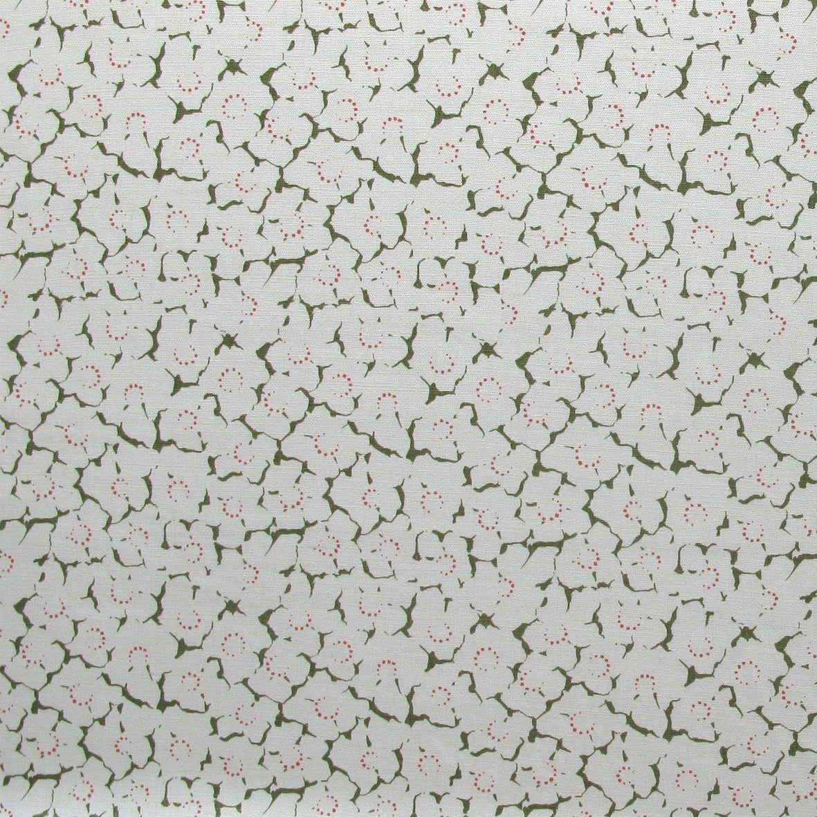 Fabric in a minimal floral print in coral and green on a cream field.