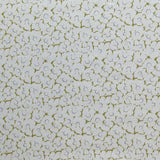 Fabric in a minimal floral print in navy and olive on a gray field.