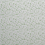 Fabric in a minimal floral print in purple and green on a gray field.
