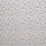 Fabric in a minimal floral print in pink and navy on a light gray field.