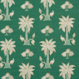 Detail of fabric in a playful palm tree print in white and brown on a green field.
