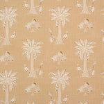 Detail of fabric in a playful palm tree print in tan and white on a light yellow field.