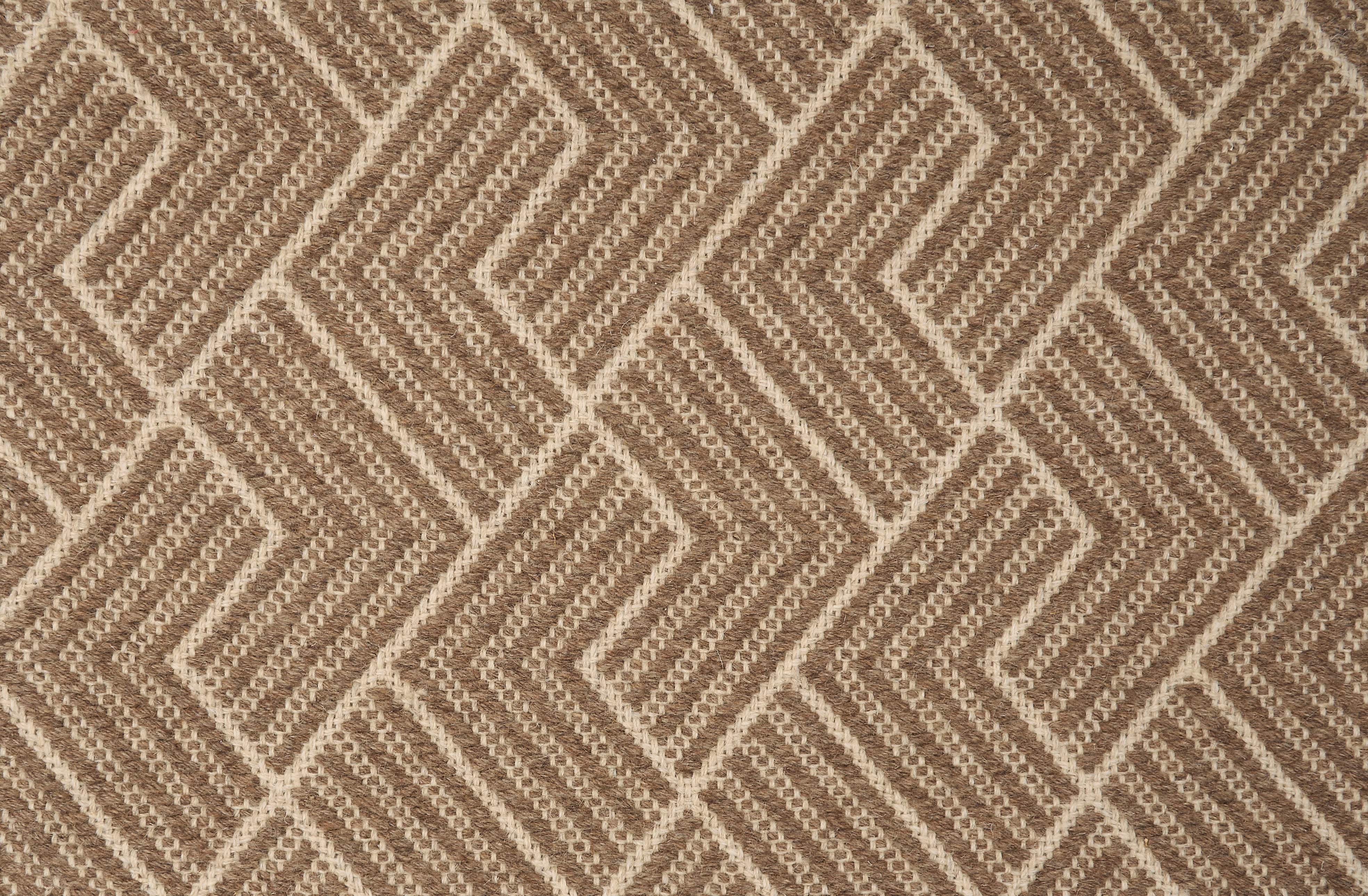 Broadloom carpet in a novel herringbone design in brown and cream
