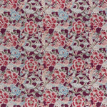 printed linen fabric in a painterly floral pattern in shades of blue, green and pink on a maroon field.