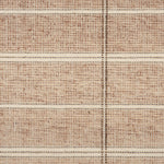 Broadloom carpet in large scale plaid in shades of rust and brown.