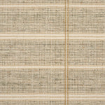 Broadloom carpet in large scale plaid in shades of tan and taupe.