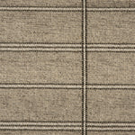 Broadloom carpet in large scale plaid in shades of grey and taupe.