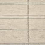 Broadloom carpet in large scale plaid in shades of grey and cream.