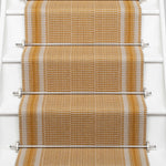 Striped flatweave runner in orange on white staircase 