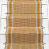 Striped flatweave runner in orange on white staircase 