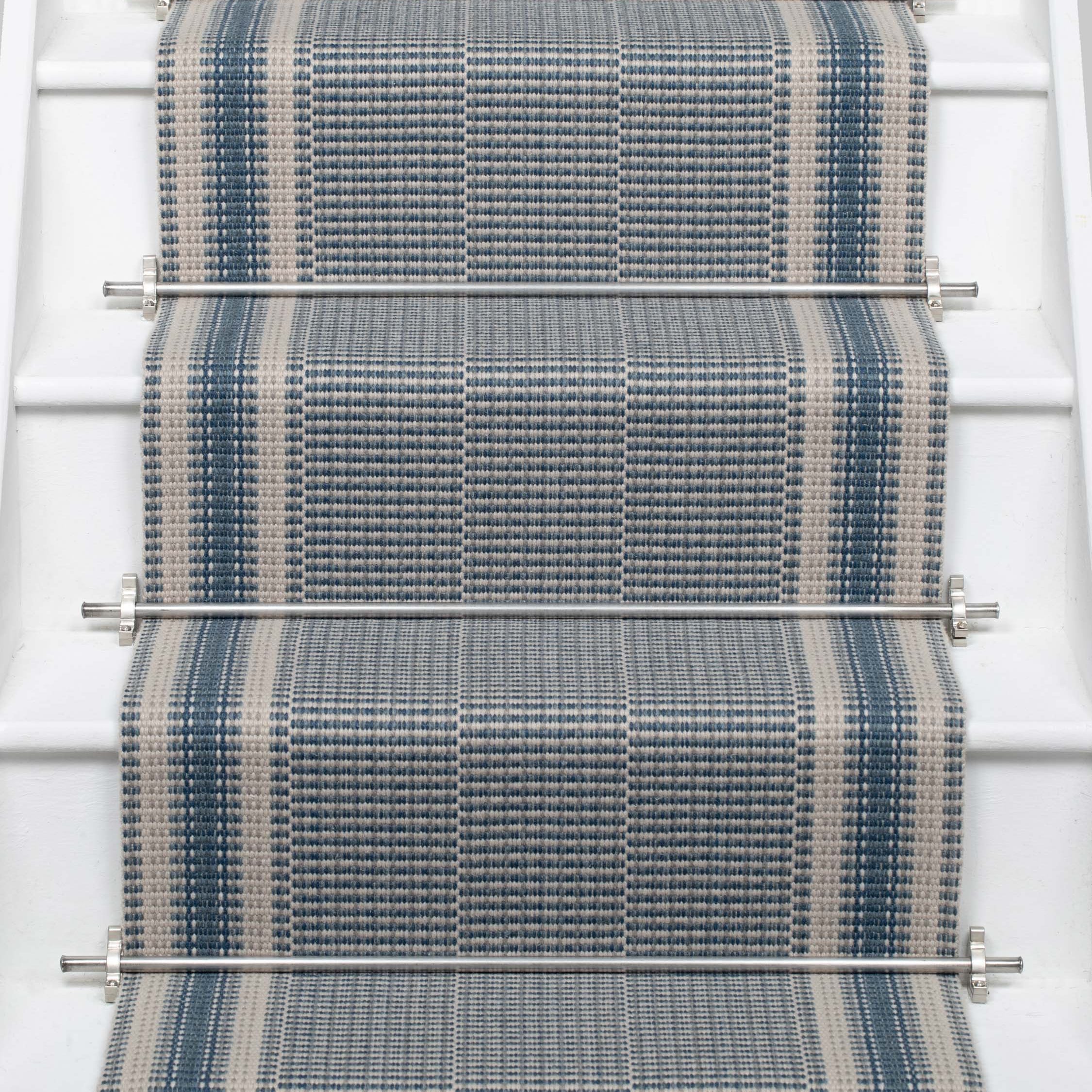 Striped flatweave runner in blue on white staircase 