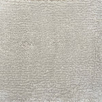 Broadloom carpet in cut pile in cool white. 
