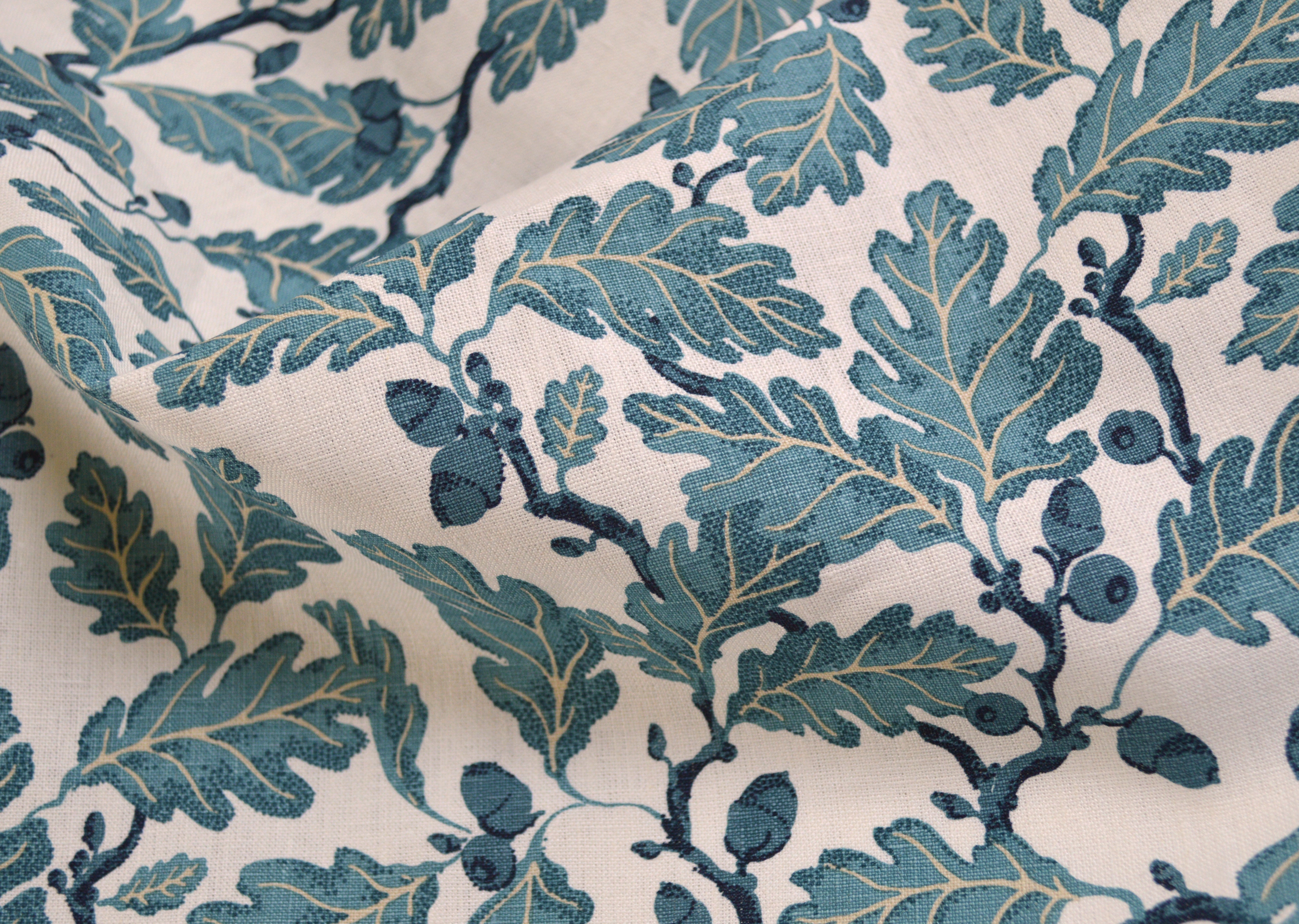 Textile with blue leaf pattern on a beige background