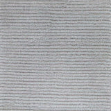 Close up of broadloom carpet with solid cut pile ribbed stripe in grey.