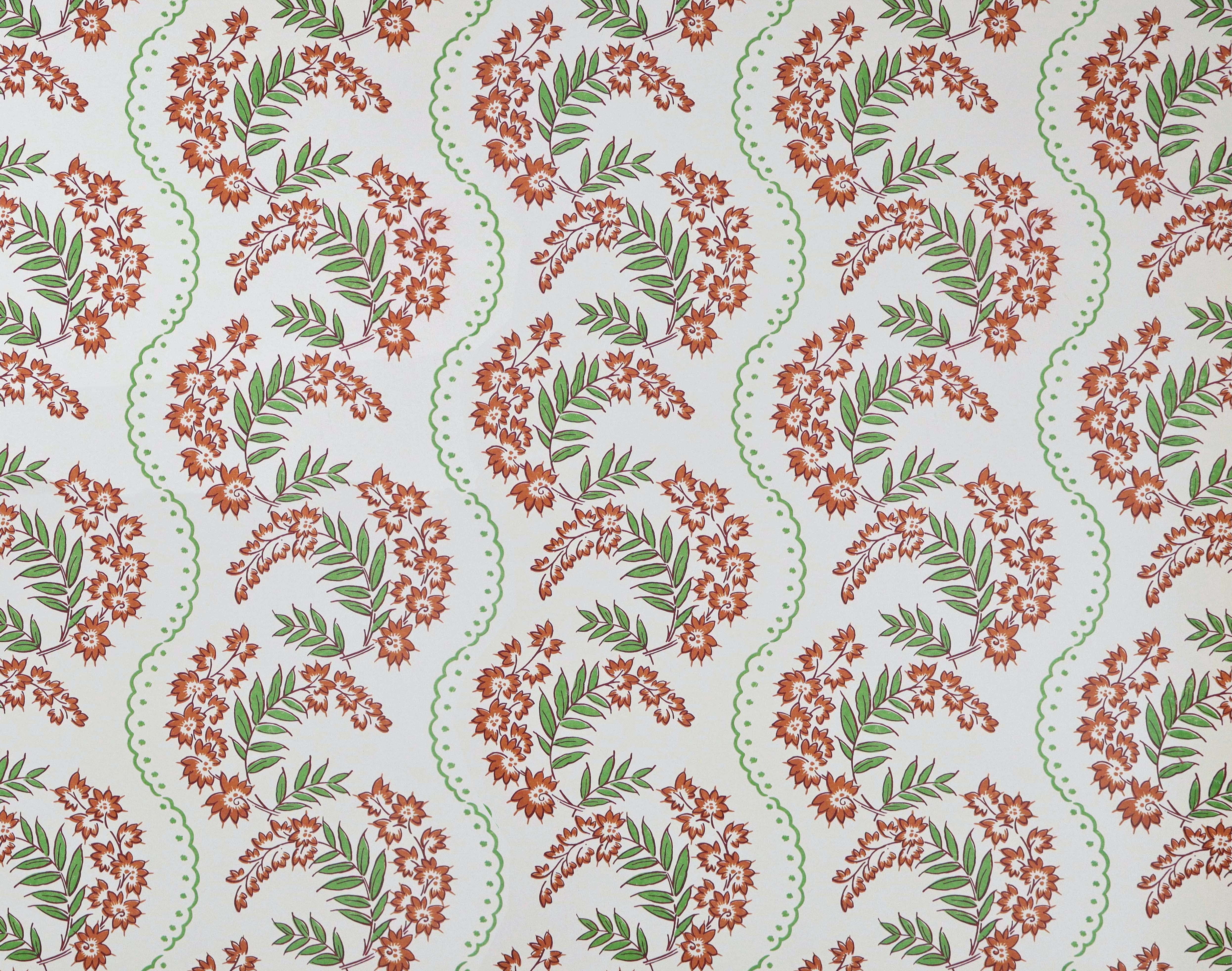 Wallpaper with floral pattern with scrolling stripes in shades of orange and green.