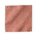 Pinned swatch of woven fabric in orange.
