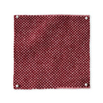 Pinned swatch of woven fabric in red. 