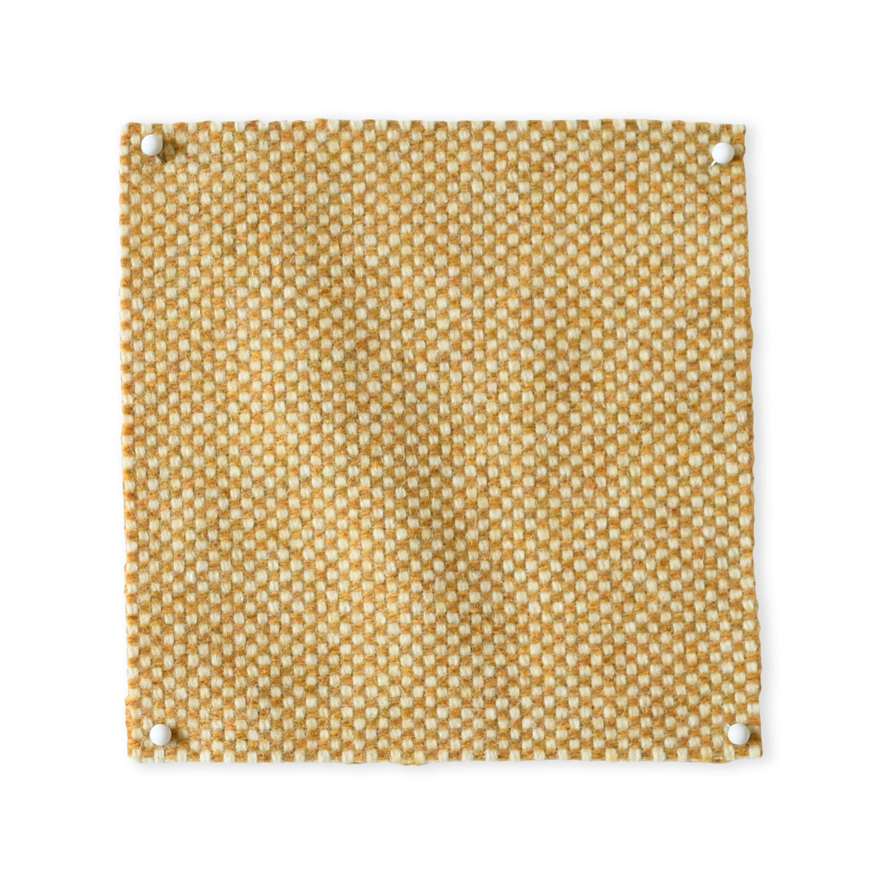 Pinned swatch of woven fabric in warm tan. 