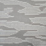 Broadloom carpet detail in an abstract cloud design in ivory and toner grey.
