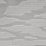 Broadloom carpet detail in an abstract cloud design in ivory and soft grey.