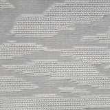 Broadloom carpet detail in an abstract cloud design in ivory and soft grey.
