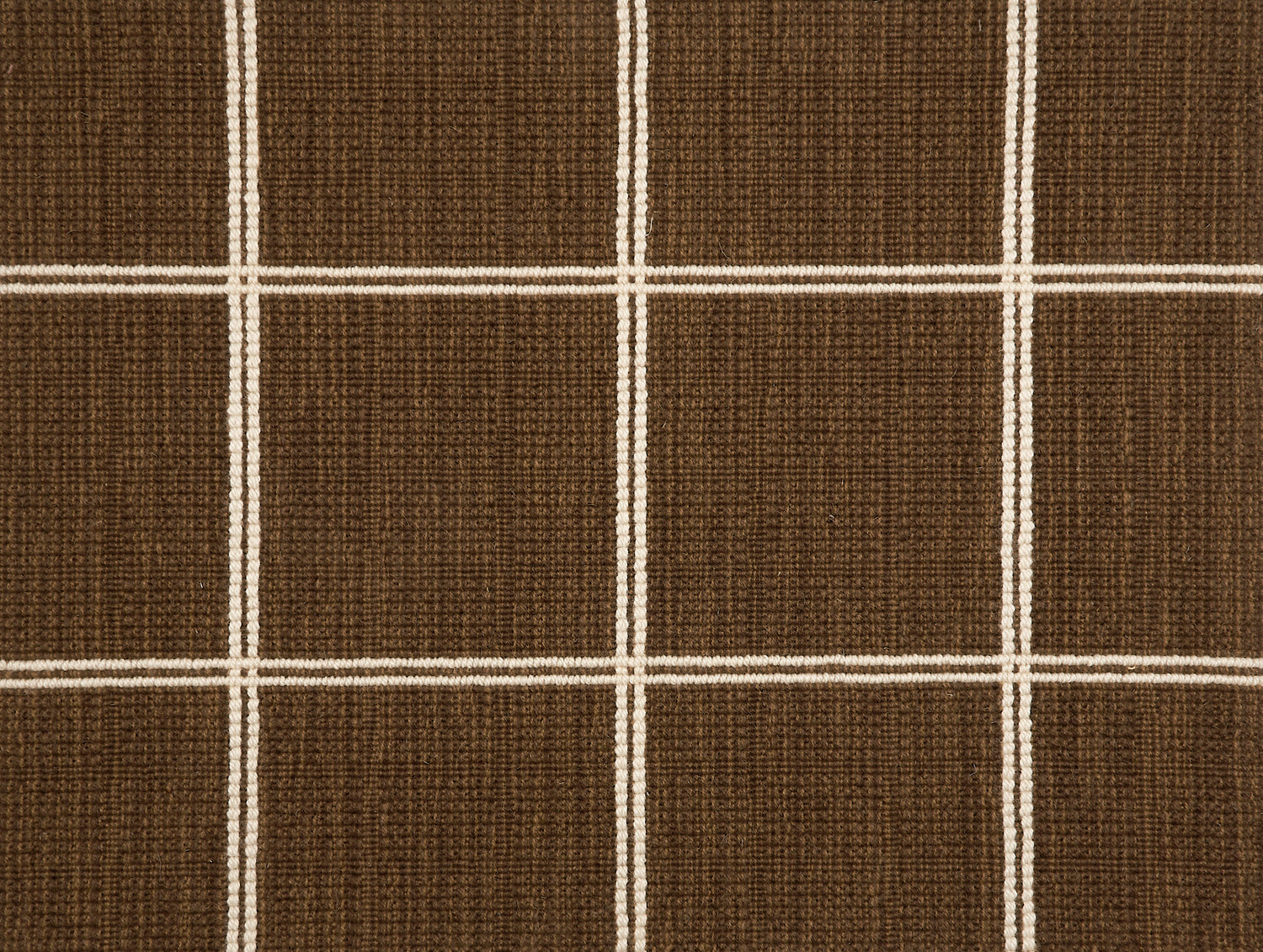Broadloom carpet sample with windowpane grid in cream on a brown background. 