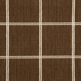 Broadloom carpet sample with windowpane grid in cream on a brown background. 
