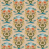Fabric in a playful snake, plant and moon print in jewel tones on a tan field. 