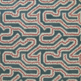 Detail of fabric in a dense meandering print in white, pink and red on a navy field.