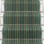 Striped flatweave runner in green blue black on white staircase