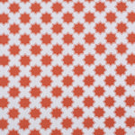 Moroccan star performance fabric in orange on white. 
