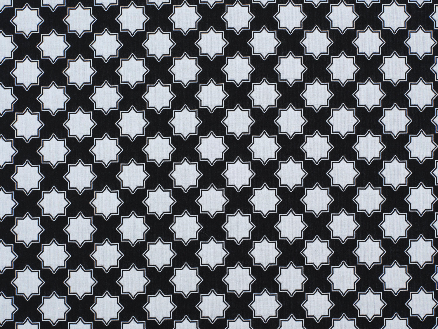 Moroccan star performance fabric in white on black