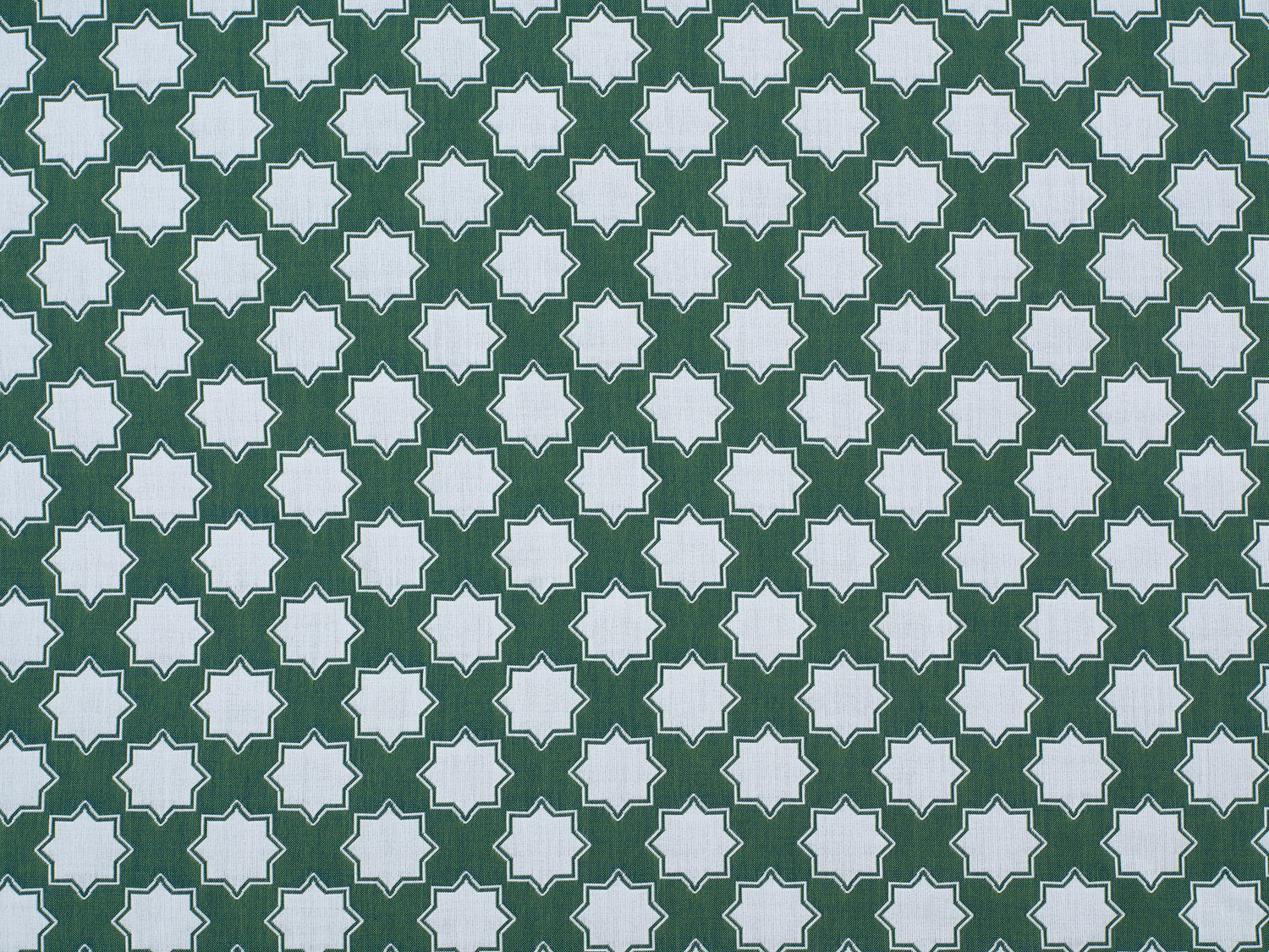 Moroccan star performance fabric in green and white. 