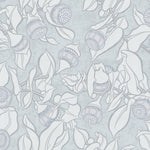 Patterned wallpaper with blooms and leaves on a light blue background