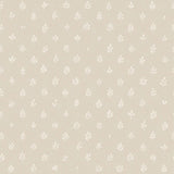 Detail of wallpaper in a repeating leaf print in white on a cream field.