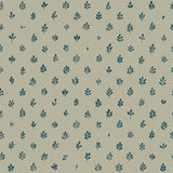 Detail of wallpaper in a repeating leaf print in navy on a sage field.