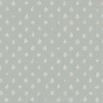 Detail of wallpaper in a repeating leaf print in cream on a light blue field.