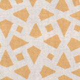 Detail of fabric in a geometric lattice print in yellow on a cream field.