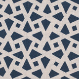 Detail of fabric in a geometric lattice print in navy on a cream field.