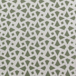 Detail of fabric in a geometric lattice print in sage on a greige field.