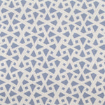 Detail of fabric in a geometric lattice print in blue on a cream field.