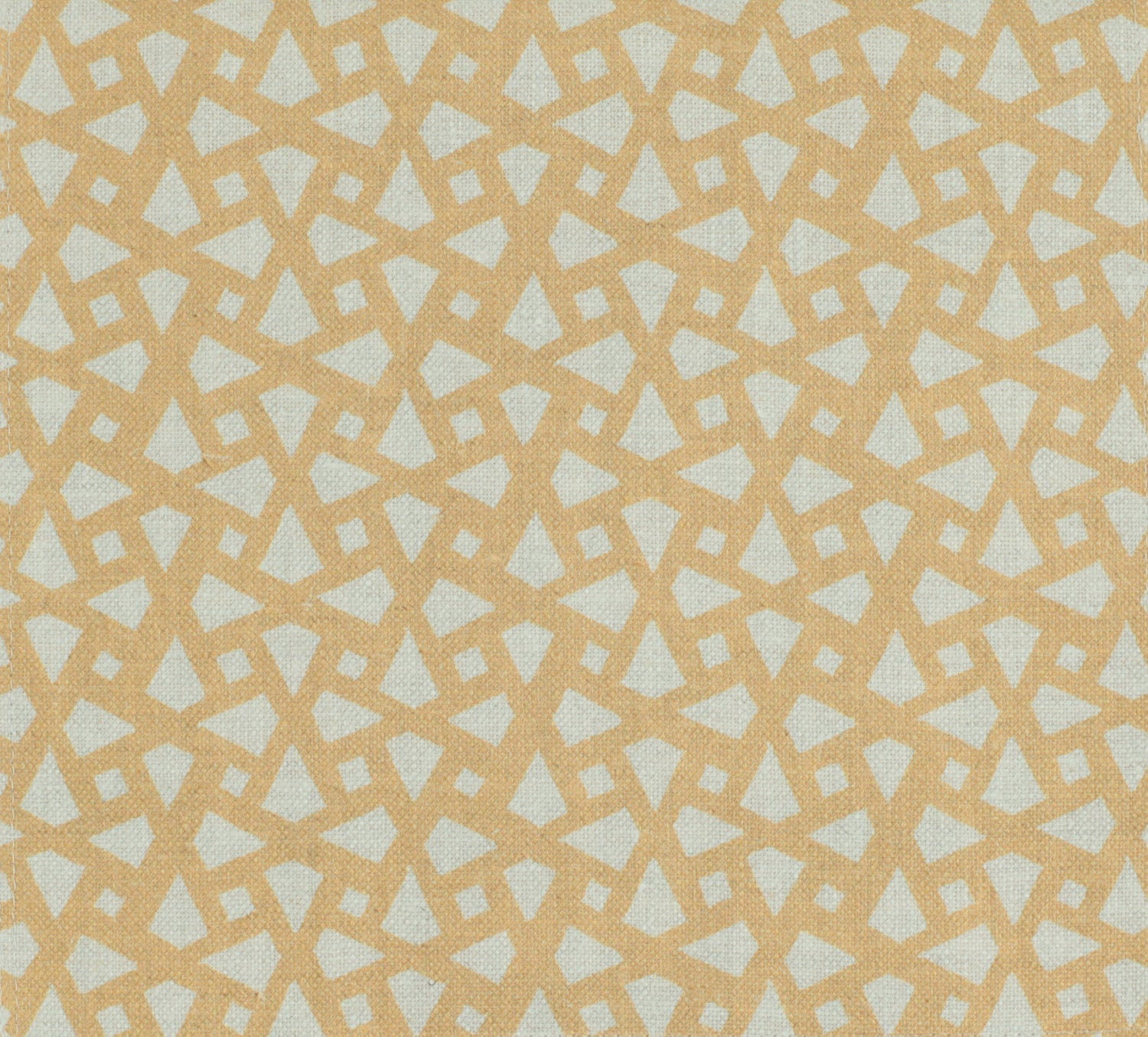 Detail of fabric in a geometric lattice print in gold on a cream field.
