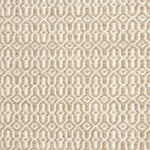 A rug with a woven overall pattern in tan and ivory.
